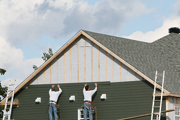 Professional Siding Installation technician working in Luxor, PA